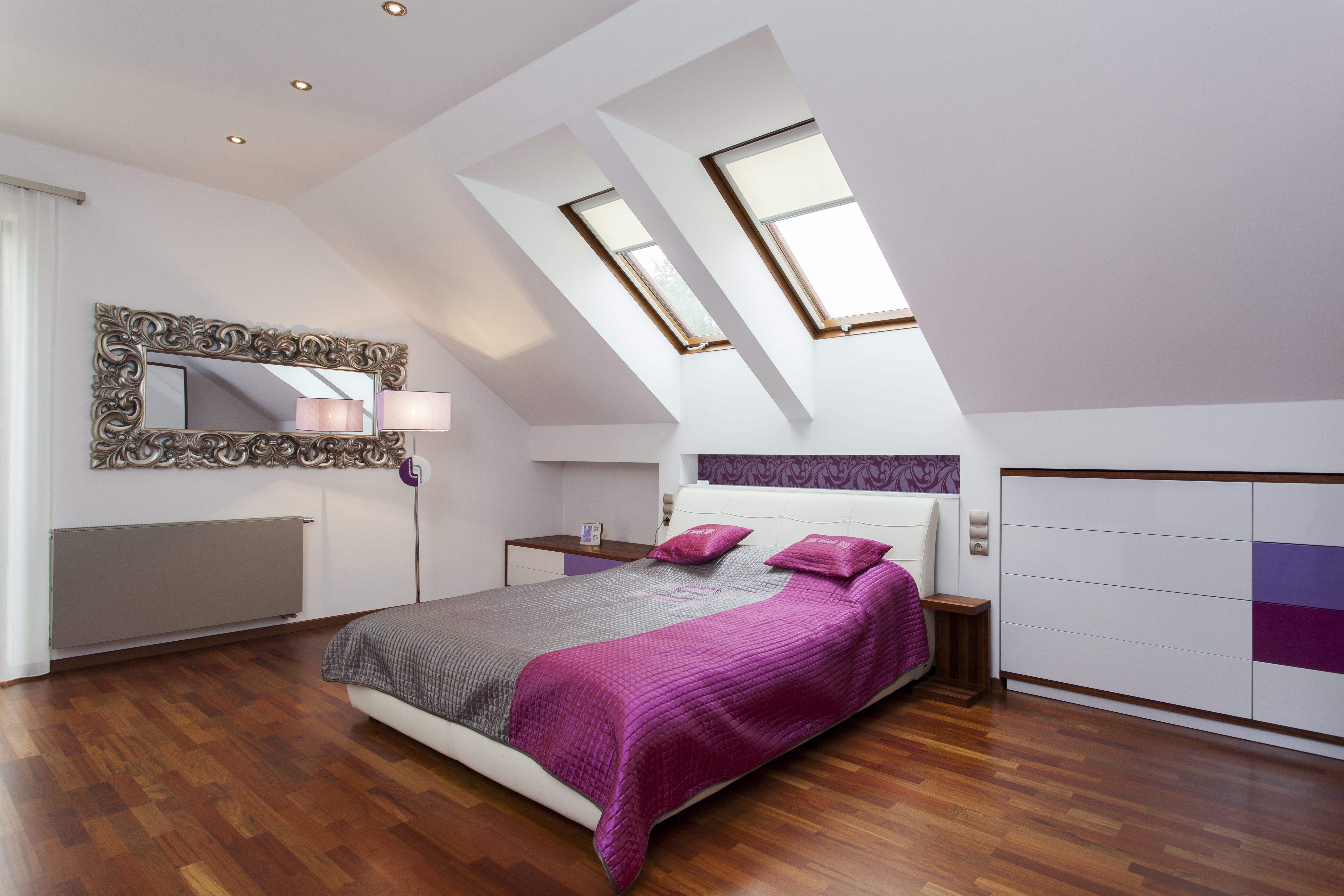 Modern bedroom in the attic of contemporary house